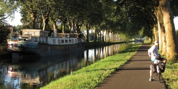 Biking along the Canal de Garonne, on the traffic-free bikeway.