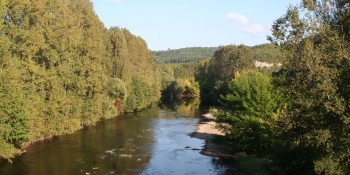 Cycling along a peaceful river