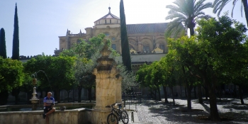 Relaxing in La Mezquita's garden in Cordoba, before tackling Andalusian hills