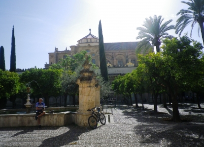 Relaxing in La Mezquita's garden in Cordoba, before tackling Andalusian hills