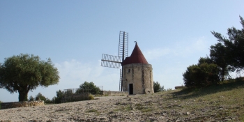 You'll bike through Fontvieille, where Alphonse Daudet's windmill is located